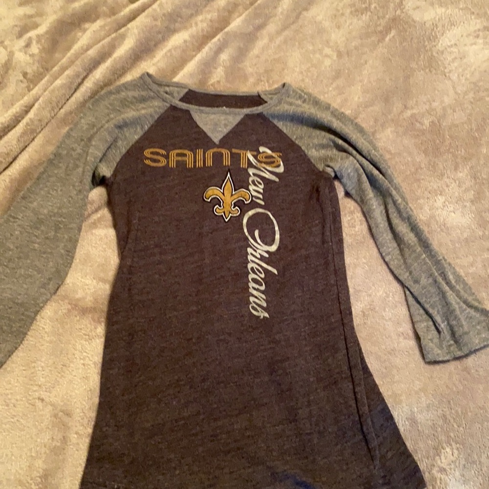 this is a saints shirt size m 10/12 girls